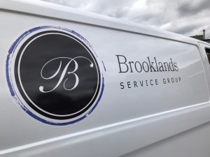 Polished service van with Brooklands Service Group logo, company branding, and professional exterior cleaning.