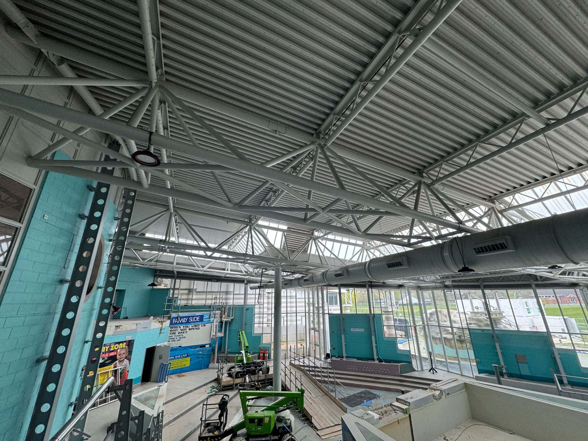 High-Level Cleaning of Internal Pipework Industrial cleaning and painting services at The Doncaster Dome by Brooklands Group, involving on-site spraying, specialist cleaning maintenance.