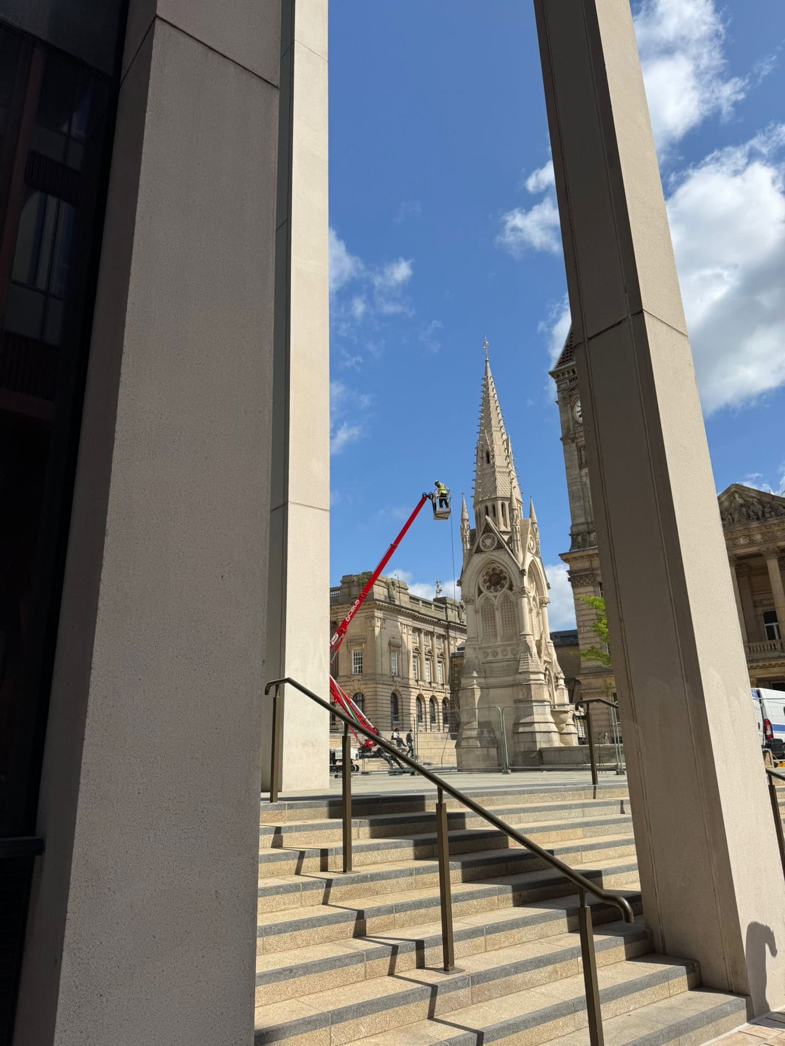 Specialist cleaning on a historic monument using specialist equipment in a city centre setting