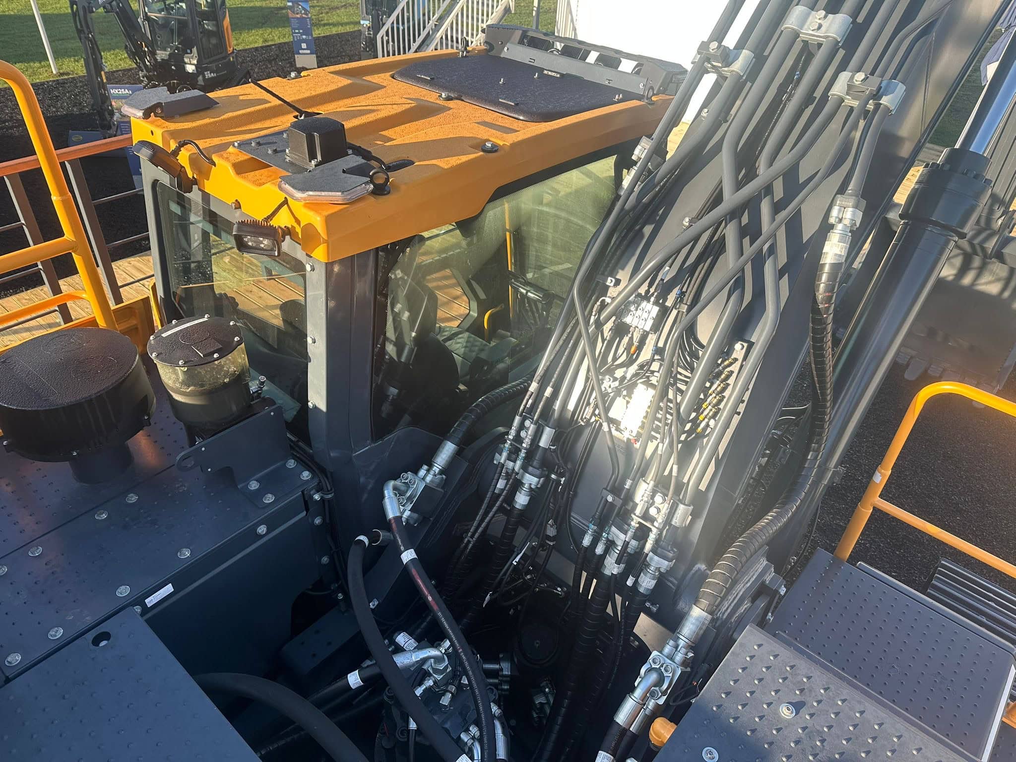Hydraulics and machinery components of an Hyundai industrial construction vehicle, showing detailed hydraulic hoses, controls, and high-performance parts for heavy-duty equipment that has been carefully cleaned by Brooklands Group