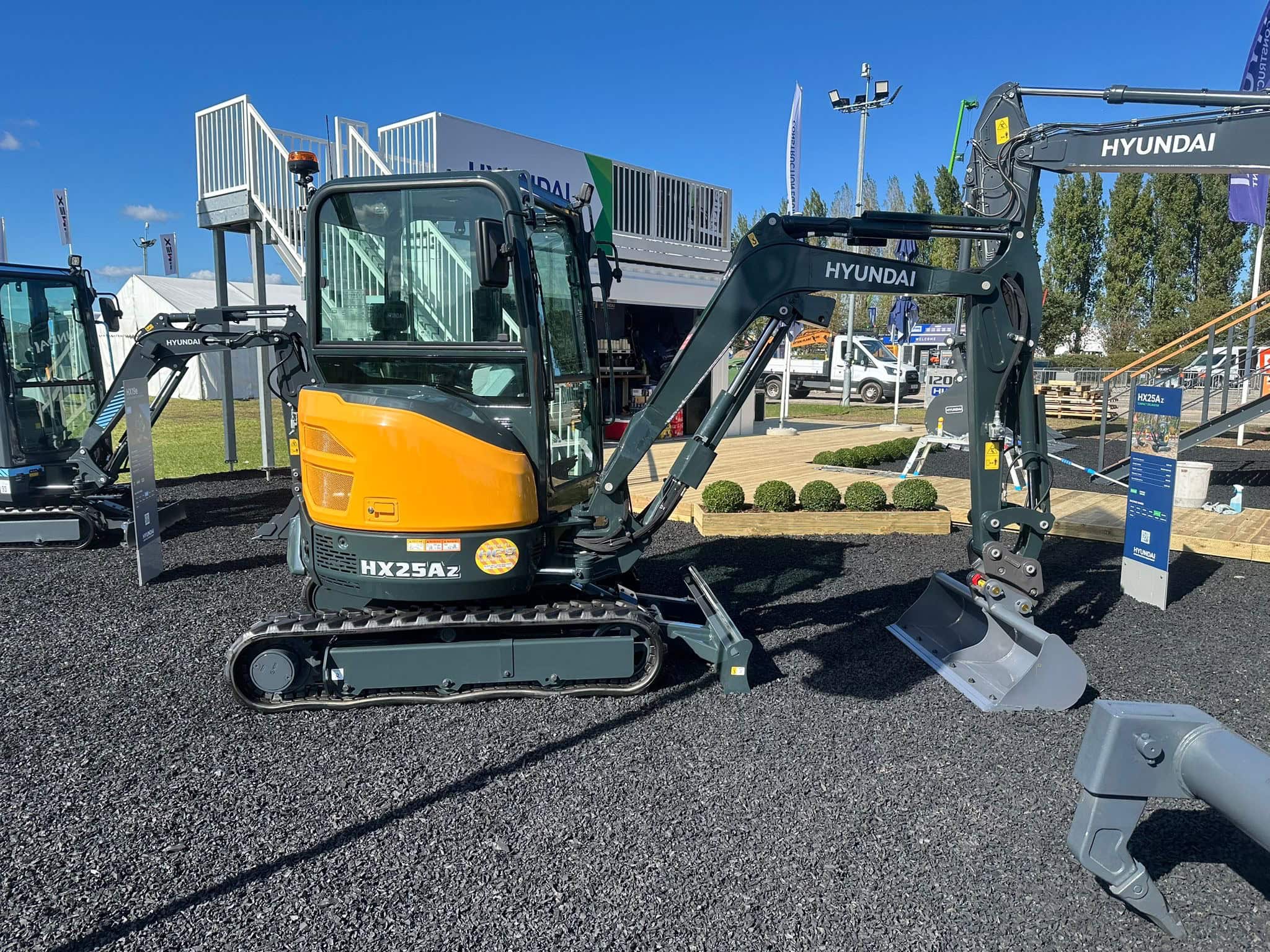 Brand new mini excavator Hyundai HX25A-Z at a construction equipment exhibition Plantworkz, showcasing modern machinery for commercial and industrial use. Machine has been cleaned by Brooklands Group.