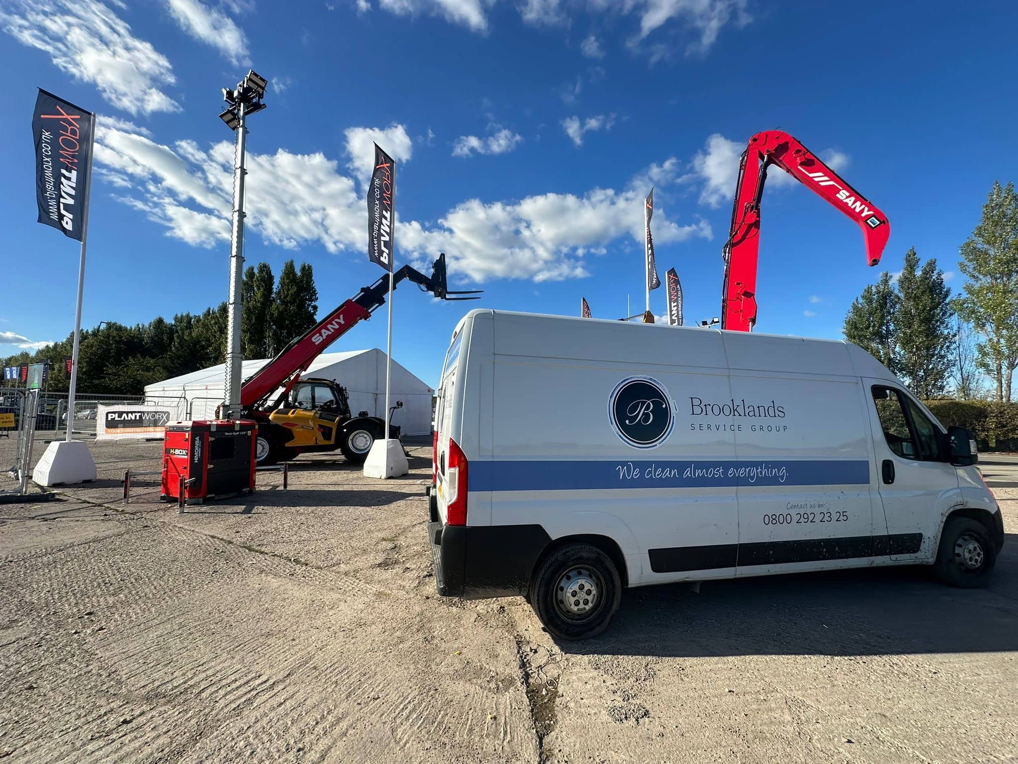 Efficient on-site industrial cleaning of machinery, heavy plant works and equipment by Brooklands Service Group with specialised equipment at an outdoor event.