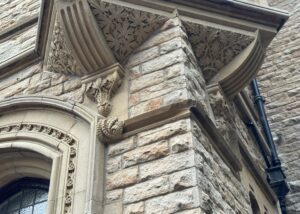 Intricate stonework and detailed architectural features on a historic building after a professional stone clean by Brooklands Service Group.
