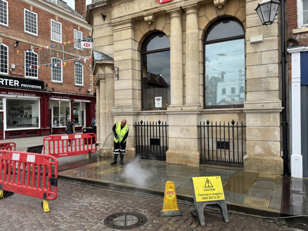 Brighton building being pressure washed by professional cleaners.